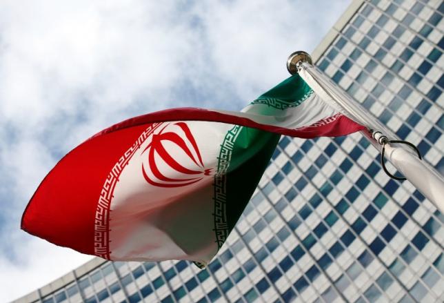 An Iranian flag flutters in front of the United Nations headquarters, during an International Atomic Energy Agency (IAEA) board of governors meeting, in Vienna, March 4, 2015.